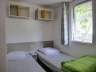 Camping Frankrijk Correze : Chambre d'enfant du mobil-home avec deux lits simples